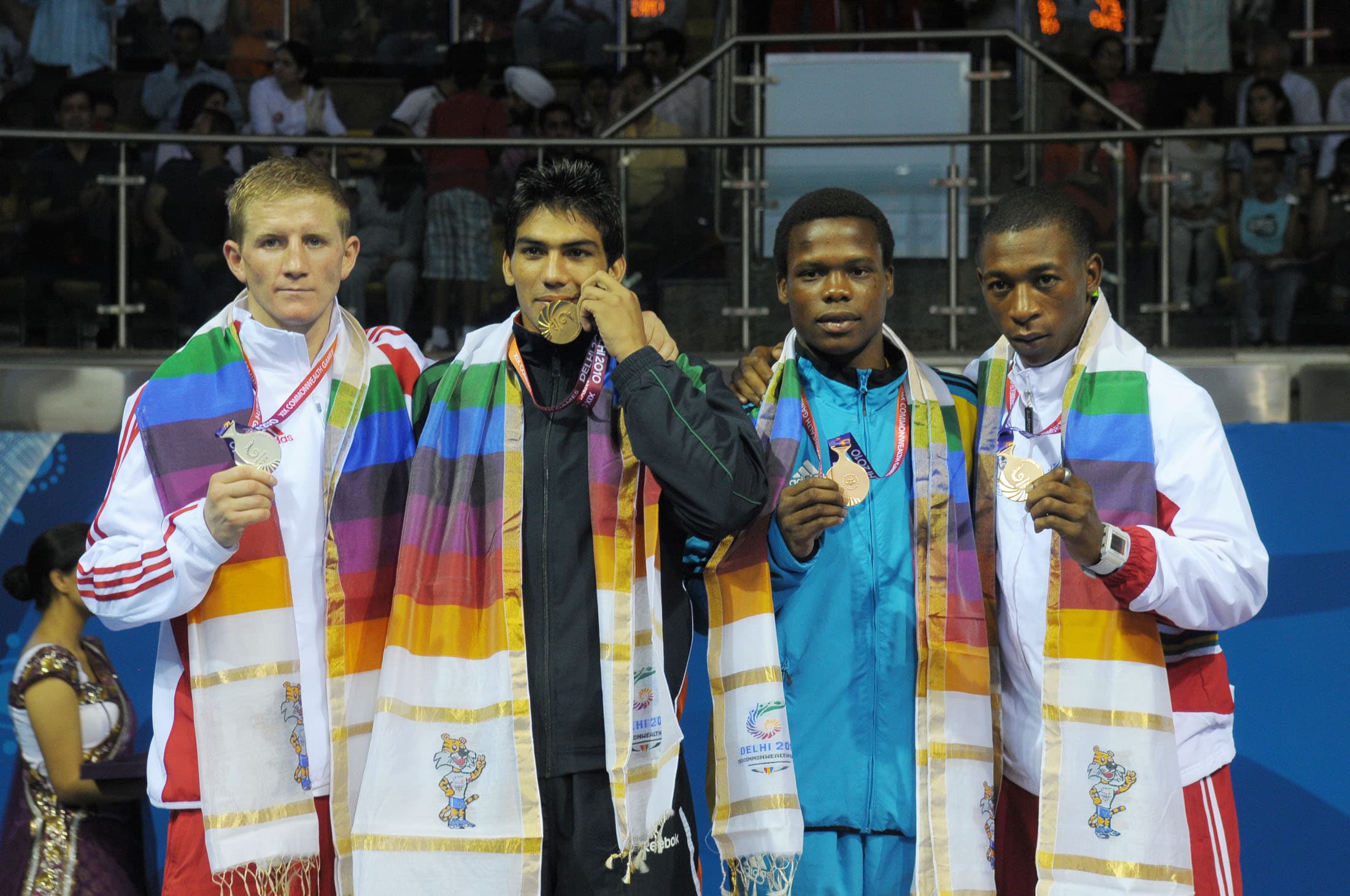 Manoj Kumar on the Commonwealth Games boxing podium in 2010